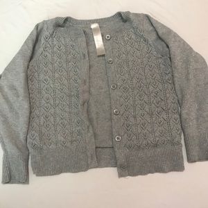 A gray cardigan
